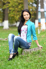 Portrait of sweet young woman enjoying at the park