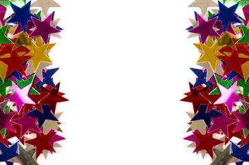Fototapeta na wymiar Christmas decoration of colored confetti stars against white bac