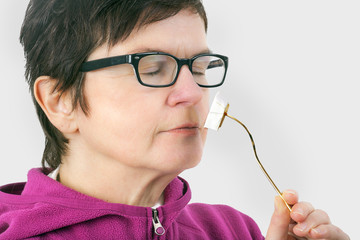 Woman smelling cheese