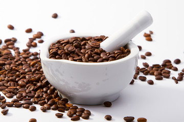 Coffee beans in a mortar