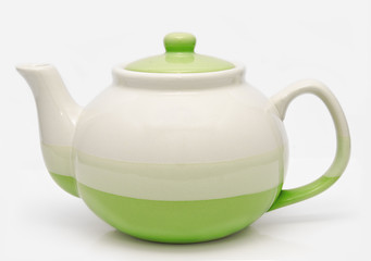 Green teapot isolated on a white