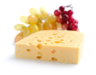 Piece of cheese is with vine on a white background