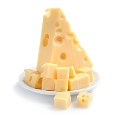 Pieces of cheese on a dish isolated on a white background