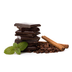 Chocolate bars stack and cinnamon sticks