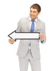 businessman with direction arrow sign