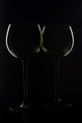 Two glasses isolated on a black background