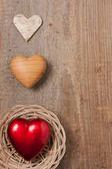 Three hearts on wood