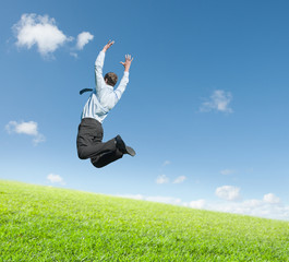 man jumping on  meadow