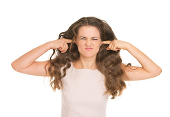 Young woman closing ears