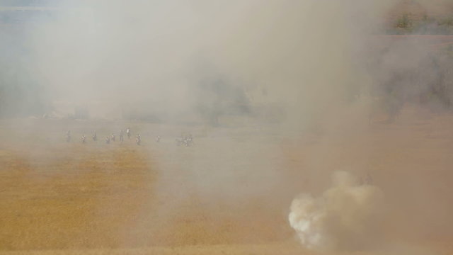 Troops on the battlefield during reenactment of a battle of 1812