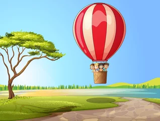 Wandcirkels plexiglas Kinderen in een luchtballon © GraphicsRF
