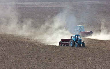 Naklejka premium Tractor plowing the field