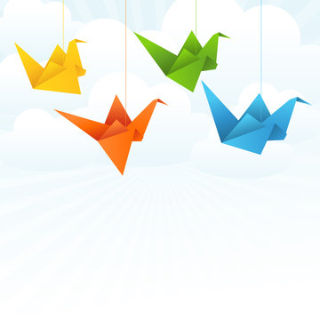 Origami paper birds flight abstract background.