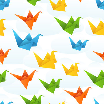 Origami paper birds flight abstract background.