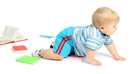 Little boy with multicolor books, isolated on white