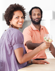 Couple dating, drinking white wine, looking at camera