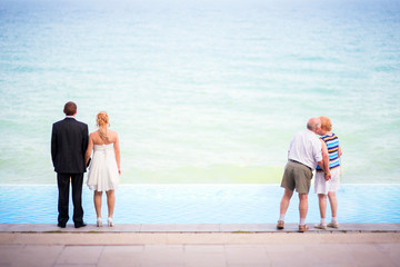 Just married and senior couples on the beach