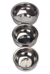 Close-up of three stainless steel cooking pots