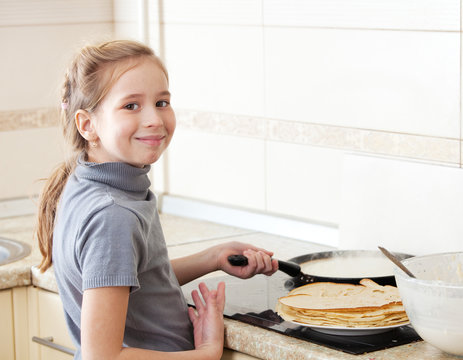Girl cooking breakfast