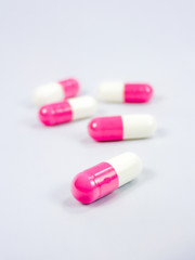 Macro of white and pink capsule.