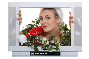 Woman in festive outfit escaping from television