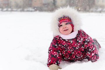 Lovely girl has a fun in snow