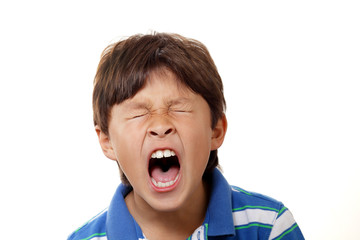 Young boy yawning