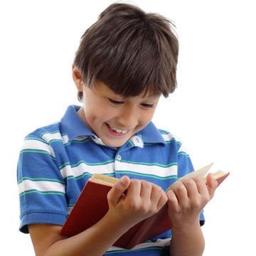 Smiling boy reads book