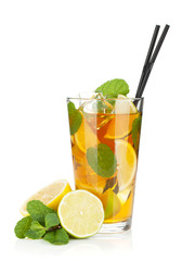 Glass of ice tea with lemon, lime and mint