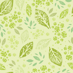 Vector stamped green leaves seamless pattern background with