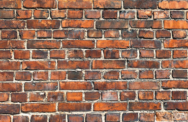 Old weathered red brick wall as background