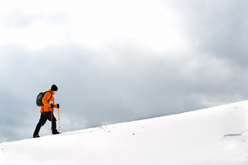 Hiker going up on a slope
