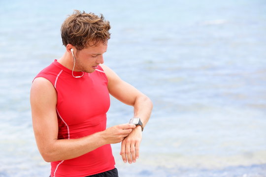 Athlete Runner Looking At Heart Rate Monitor Watch