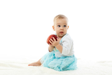 Sweet small baby with apple.