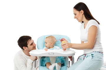 Fototapeta premium Young parents feed baby.