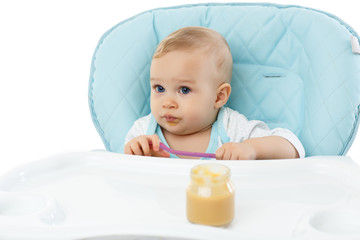 Sweet baby with spoon.