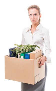 Portrait of business woman holding a box with her belongings
