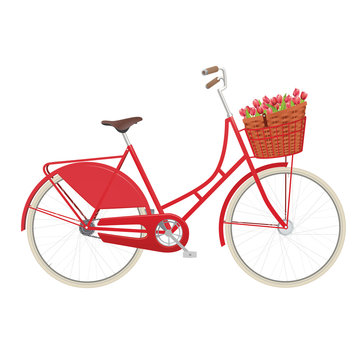 Vintage ladies bicycle with wicker basket filled with tulips