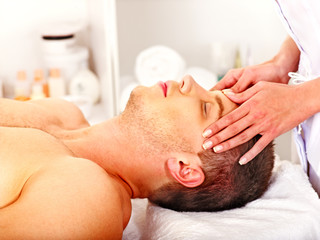 Fototapeta na wymiar Man getting facial massage .