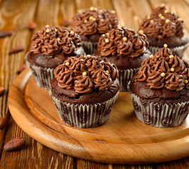 Chocolate cupcakes on a brown table
