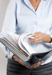 woman looking in a binder