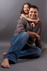 Happy East Indian man with his daughter