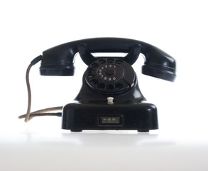 Vintage telephone on white
