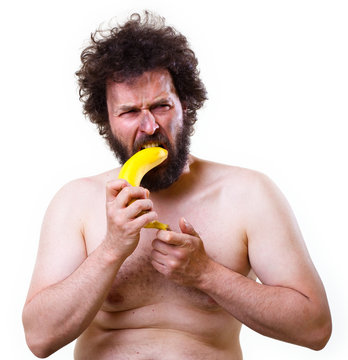 Caveman trying to eat a banana