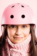 funny woman wearing Cycling Helmet portrait pink background real