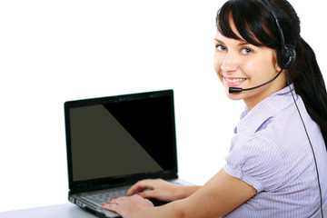 A woman with a laptop and headset