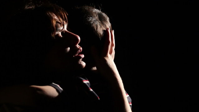 Mother And Son On A Black Background 2