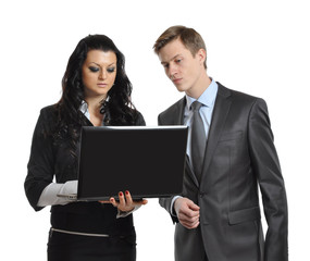 Business people looking at laptop