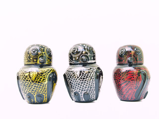 The colorful artistic lacquerwear owls isolated on white.