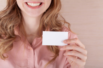 Business woman holding her visiting card